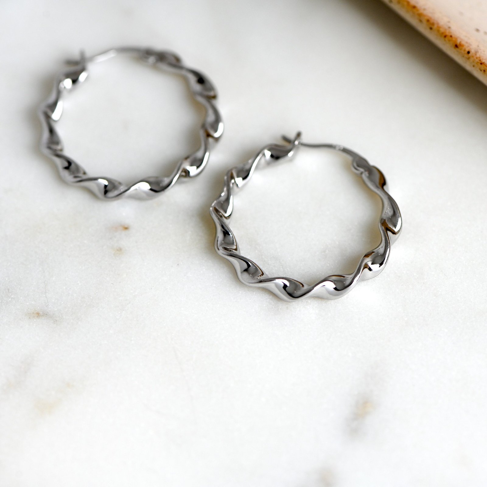 ribbon-hoops-scaled-1.jpg 925 Silver Ribbon Hoop Earrings - Image 1