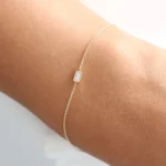 Chic and graceful, our 925 Silver Dainty Baguette Diamond Bracelet is the perfect accessory for a touch of everyday luxury. Expertly crafted from high-quality 925 sterling silver, this bracelet is built to offer lasting beauty and refined elegance. Each piece is finished with a thick, durable layer of 14K gold or rose gold plating, delivering a rich, luminous shine that highlights its delicate design.  Nickel-free and hypoallergenic, the Dainty Baguette Diamond Bracelet is safe for sensitive skin, ensuring comfortable wear all day long. Featuring sparkling baguette-cut highest-grade cubic zirconia stones, it offers a brilliant, diamond-like radiance with a modern, minimalist edge. Whether worn alone for subtle sophistication or stacked with other favorites, this bracelet is a versatile and stylish addition to any jewelry collection.  At Swarish Jewels Boutique, we are committed to providing fine craftsmanship along with outstanding service. Your Dainty Baguette Diamond Bracelet will be processed and shipped within 7–8 business days. Plus, our dedicated customer support team is always available through live chats and video calls to assist you. - Image 5