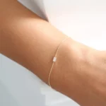 Chic and graceful, our 925 Silver Dainty Baguette Diamond Bracelet is the perfect accessory for a touch of everyday luxury. Expertly crafted from high-quality 925 sterling silver, this bracelet is built to offer lasting beauty and refined elegance. Each piece is finished with a thick, durable layer of 14K gold or rose gold plating, delivering a rich, luminous shine that highlights its delicate design.  Nickel-free and hypoallergenic, the Dainty Baguette Diamond Bracelet is safe for sensitive skin, ensuring comfortable wear all day long. Featuring sparkling baguette-cut highest-grade cubic zirconia stones, it offers a brilliant, diamond-like radiance with a modern, minimalist edge. Whether worn alone for subtle sophistication or stacked with other favorites, this bracelet is a versatile and stylish addition to any jewelry collection.  At Swarish Jewels Boutique, we are committed to providing fine craftsmanship along with outstanding service. Your Dainty Baguette Diamond Bracelet will be processed and shipped within 7–8 business days. Plus, our dedicated customer support team is always available through live chats and video calls to assist you. - Image 3